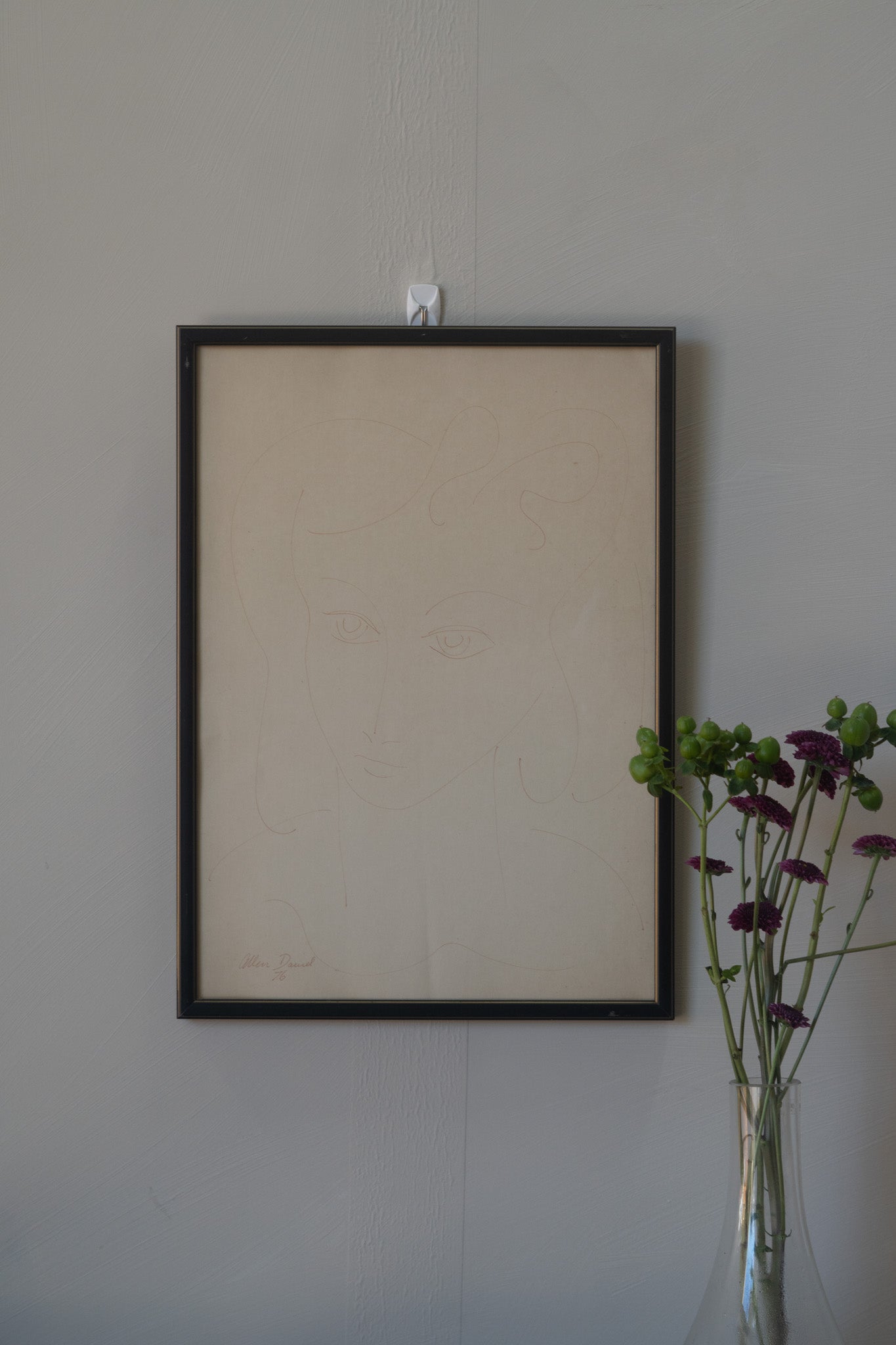 Minimalist line sketch of woman in frame, 1976