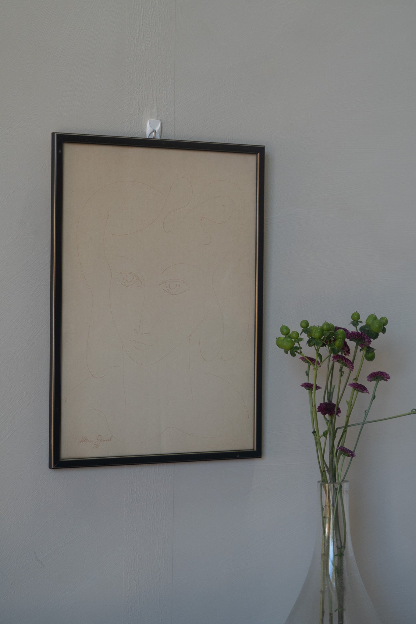 Minimalist line sketch of woman in frame, 1976