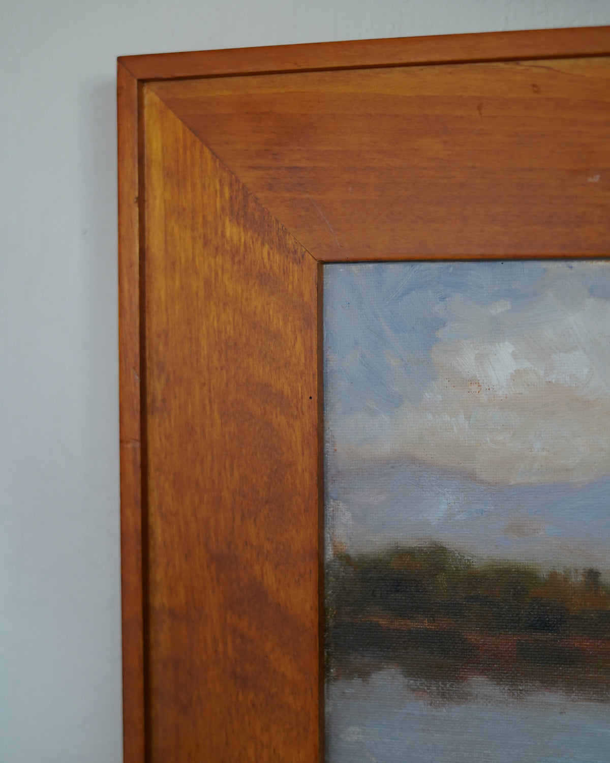 Oil painting of trees reflected in a lake with mountains, Peter Dann